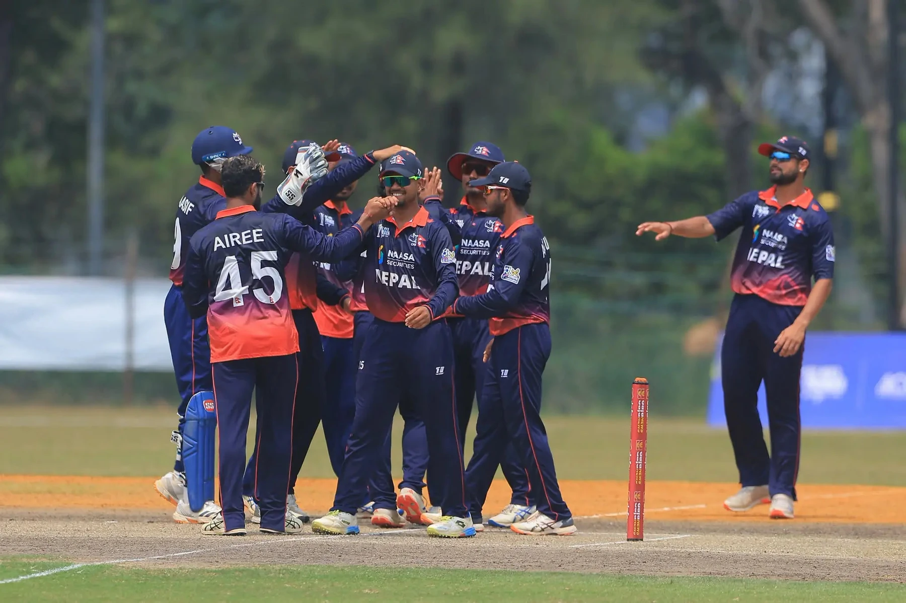Nepal celebrate the victory that secured their Asia Cup place.